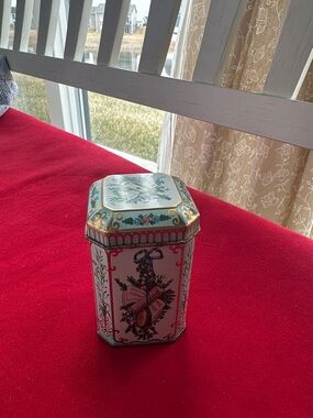 VTG Meister tin container ,an ornate musical and floral motif, made in Brazil